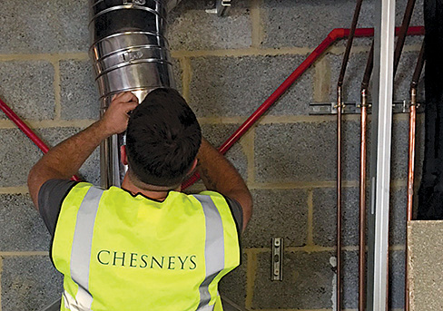 Chesney HETAS-registered installer working on chimney liner